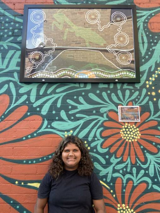 Young artist, Michelle Quinlan stands with her painting at the 2024 Youth Laneway Festival in Kempsey. Picture supplied