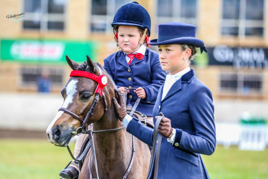 Stella Noble came runner-up in the Northern NSW Hack championship in the tiny tots class. She was led by Kempsey local Miss Brianna during the event. Picture supplied by Hoofprintz Photography. 