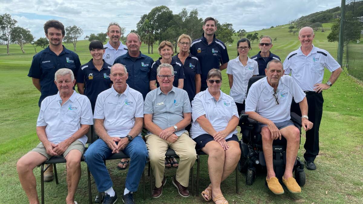 Crescent Head Country Club secretary manager Colan Ryan (right) and chairperson Pam Bryant (seated) with club staff and board members. Picture supplied