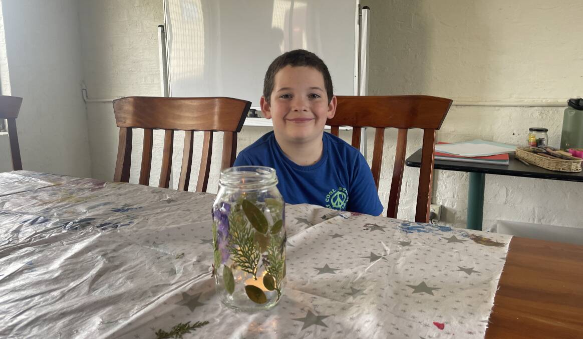 Brax is proud of his creation and says the candle will sit in the middle of kitchen table at home during meals and when used as a work space during lessons. Picture by Ellie Chamberlain