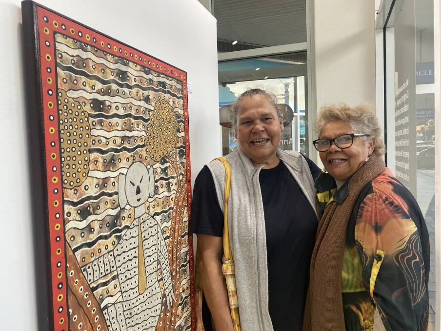  Aunty Colleen and Aunty Cheryl stand with a favourite work of theirs from Robert Campbell Junior. Picture by Ellie Chamberlain