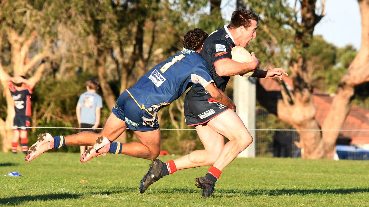 Macleay Valley fullback Tirell Dungay stops Old Bar's Dylan Coles with a great covering during the second half of the clash at Old Bar on Saturday, June 29. Picture Scott Calvin.