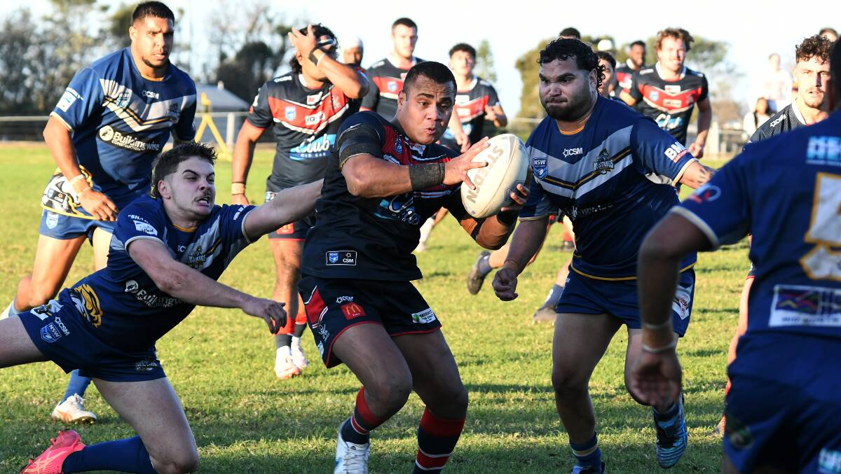 Macleay defenders move in on Old Bar winger Simon Wise, who caused the Mustangs plenty of problems during the clash at Old Bar on Saturday, June 29. Picture Scott Calvin