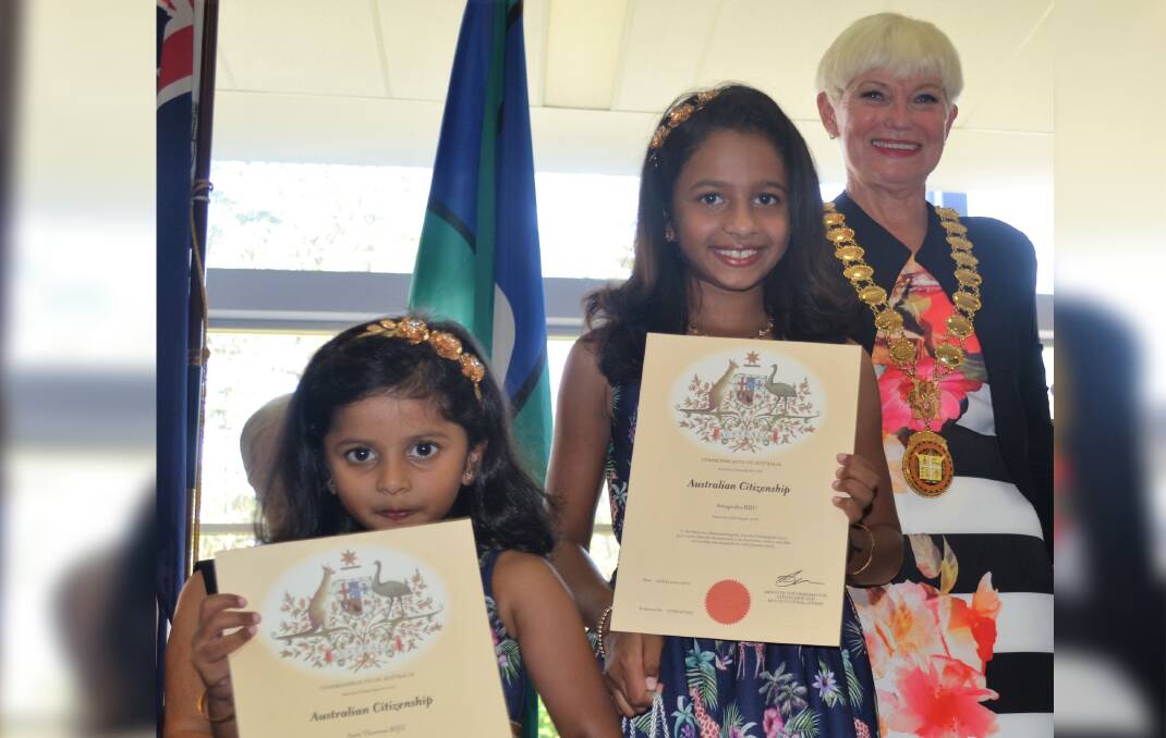 Mayor Liz Campbell congratulating newest citizens, sisters Ann-Theresa and Anugraha Biju from India. Photo: Supplied