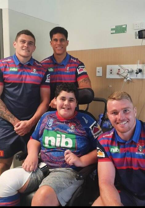 Troy Newman pictured with players from the Newcastle Knights. Photo: Supplied 