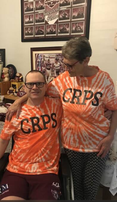 Dean Harvey with his mother Helen in their CRPS shirts