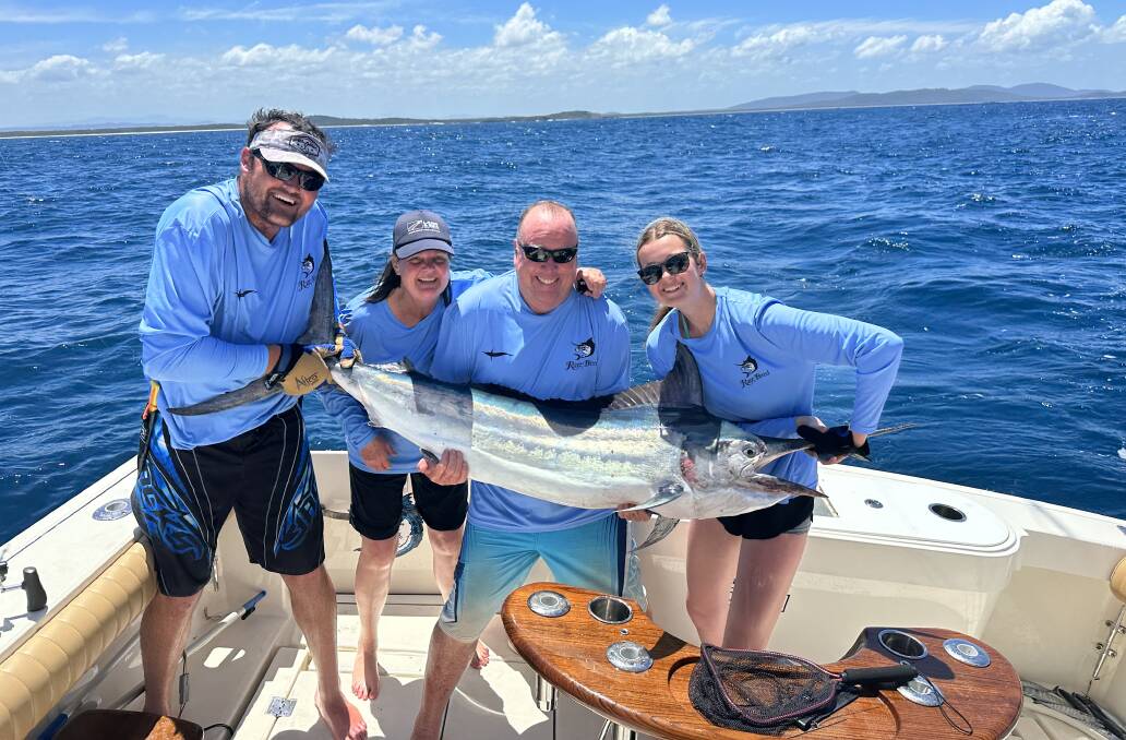 The Lamond family with a black marlin tagged and released off Point Plomer. Picture: supplied. 