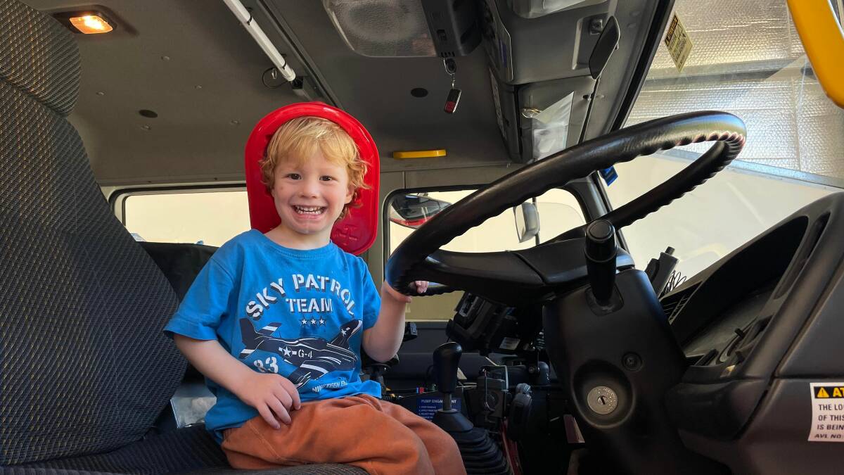 Jack Peake enjoying sitting in the fire truck at the Fire and Rescue NSW South West Rocks open day event. Picture by Liz Langdale 