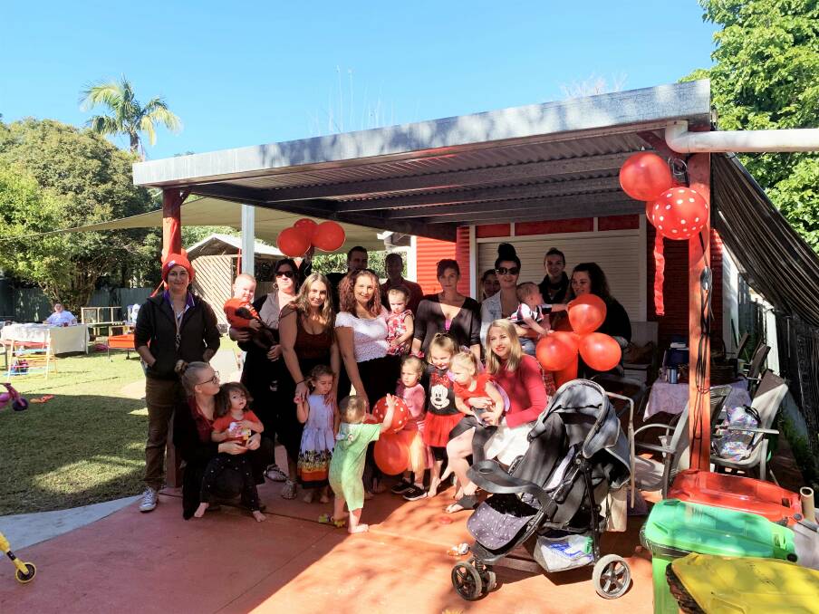 Staff and playgroup participants at 'Seeing Red' day from Kempsey Families Inc. Photo: Supplied