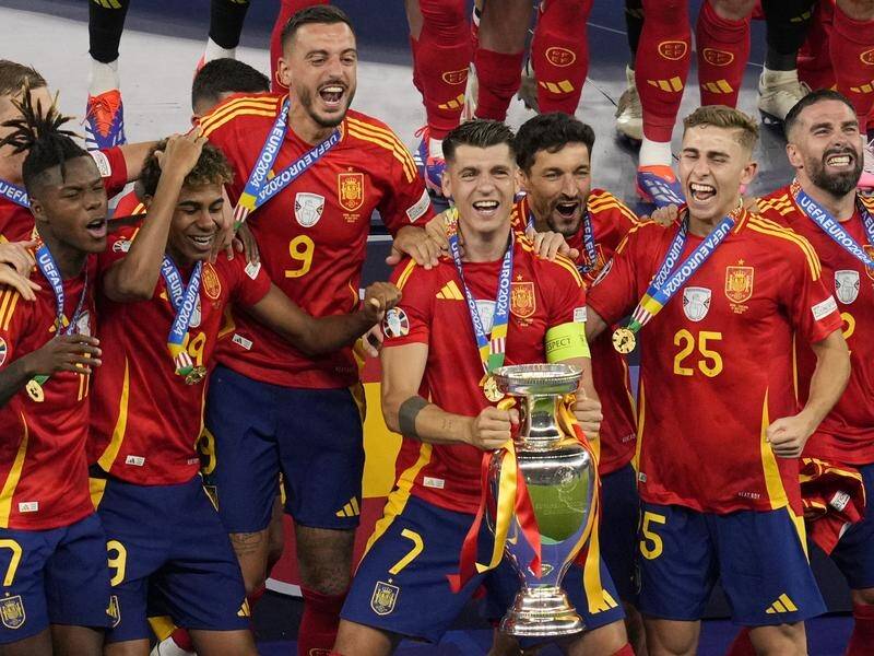 Captain Alvaro Morata holds the trophy after Spain's Euro 2024 final triumph over England in Berlin. (AP PHOTO)