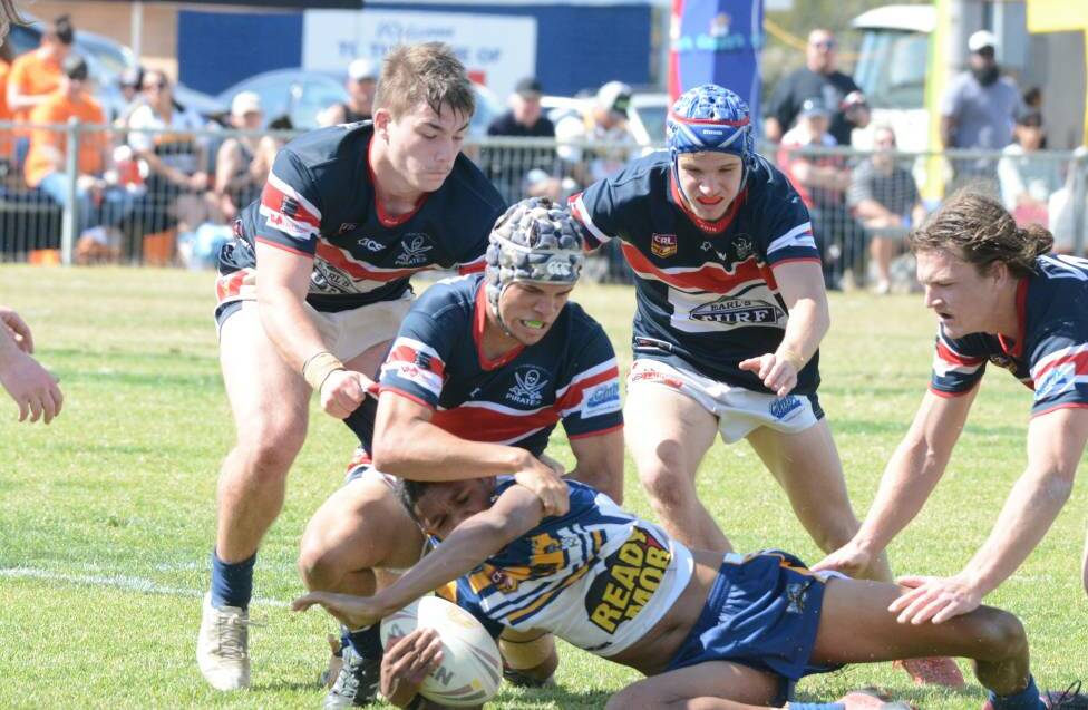 Old Bar defenders swarm on a Macleay player during last year's under 18 grand final. Photo: File 