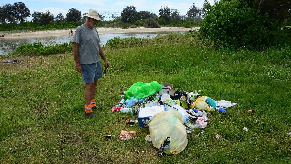 Just too much: John Westaway with some of the rubbish left behind by illegal campers near Willow St, Crescent Head.