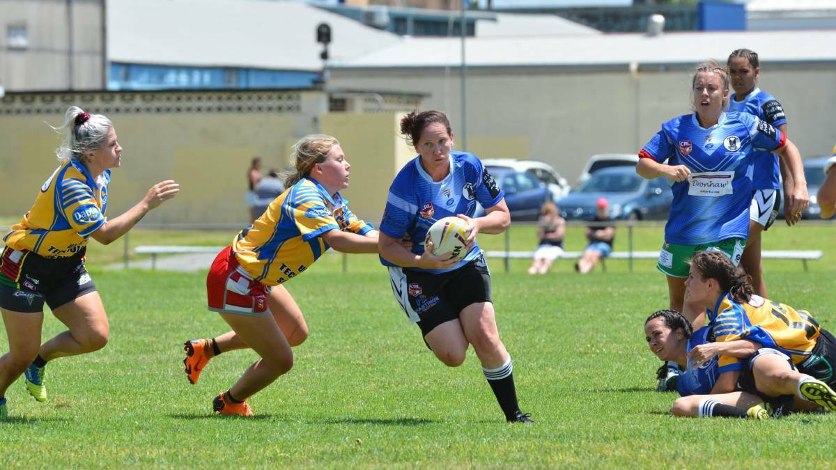Tough carry: Prop forward Ellen Hetherington carries the ball forward for Group Three. Photo: Penny Tamblyn.