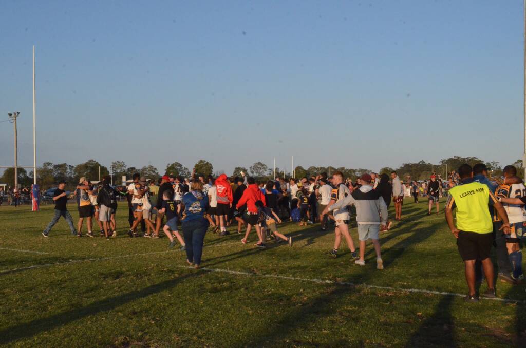 Mustangs supporters swamp the field after the grand final victory. Photo: Callum McGregor