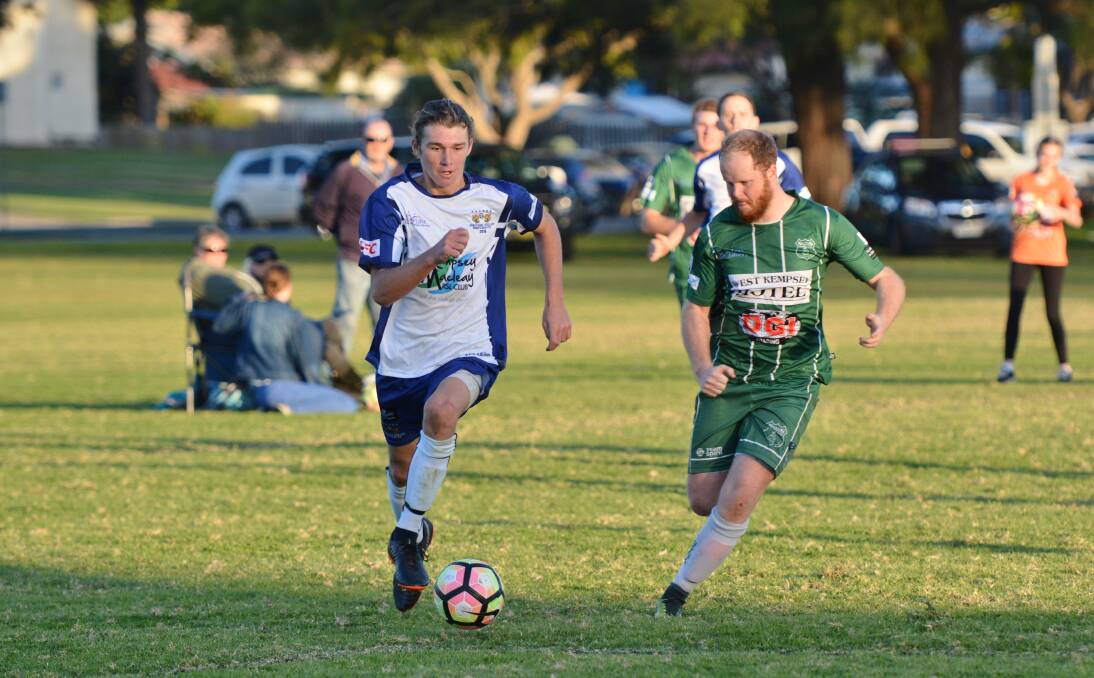 Battle for the ball: The Macleay Valley Rangers face a tough month of football before the finals series commences. Photo: Penny Tamblyn.