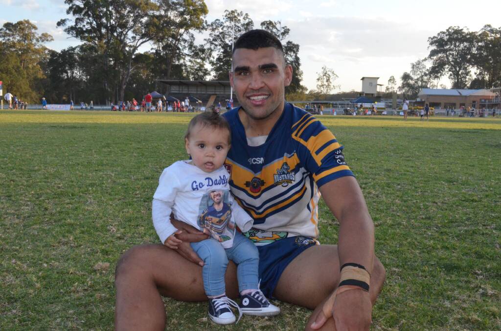 Richie Roberts with baby Zhade after winning the Group Three Rugby League title. Photo: Callum McGregor