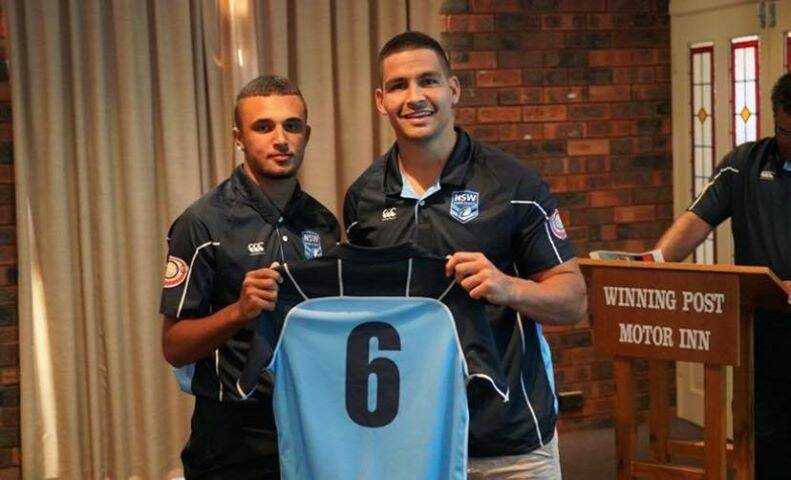 Proud moment: South Sydney Rabbitohs five-eighth and NRL Indigenous All-star captain Cody Walker presenting Kempsey's Tim Bull with his NSW jersey. Photo: Supplied.