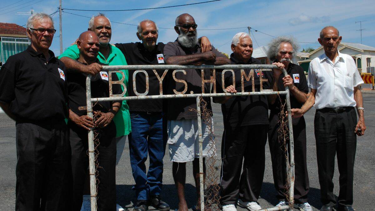 Painful past: Elders Michael Welsh, Willie Leslie, Richard Campbell, Manuel Ebsworth, Ian Lowe, Vincent Wenberg, Cecil Bowden and Harold ‘Bluey’ Smith with part of the gate from the Kinchela Boys’ Home, where they spent much of their childhood