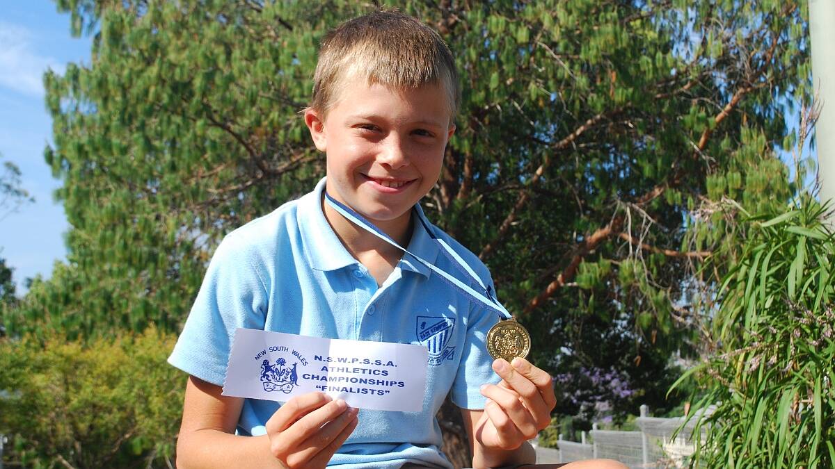 Sprint star: Darby Lancaster shows off the 100m gold medal he won at the NSW PSSA Athletics Championships
